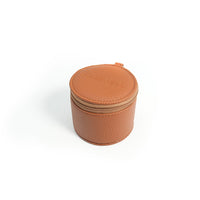 A tan leather zippered case, designed for carrying Freewell anamorphic, wide angle, and 1.7x telephoto lenses.