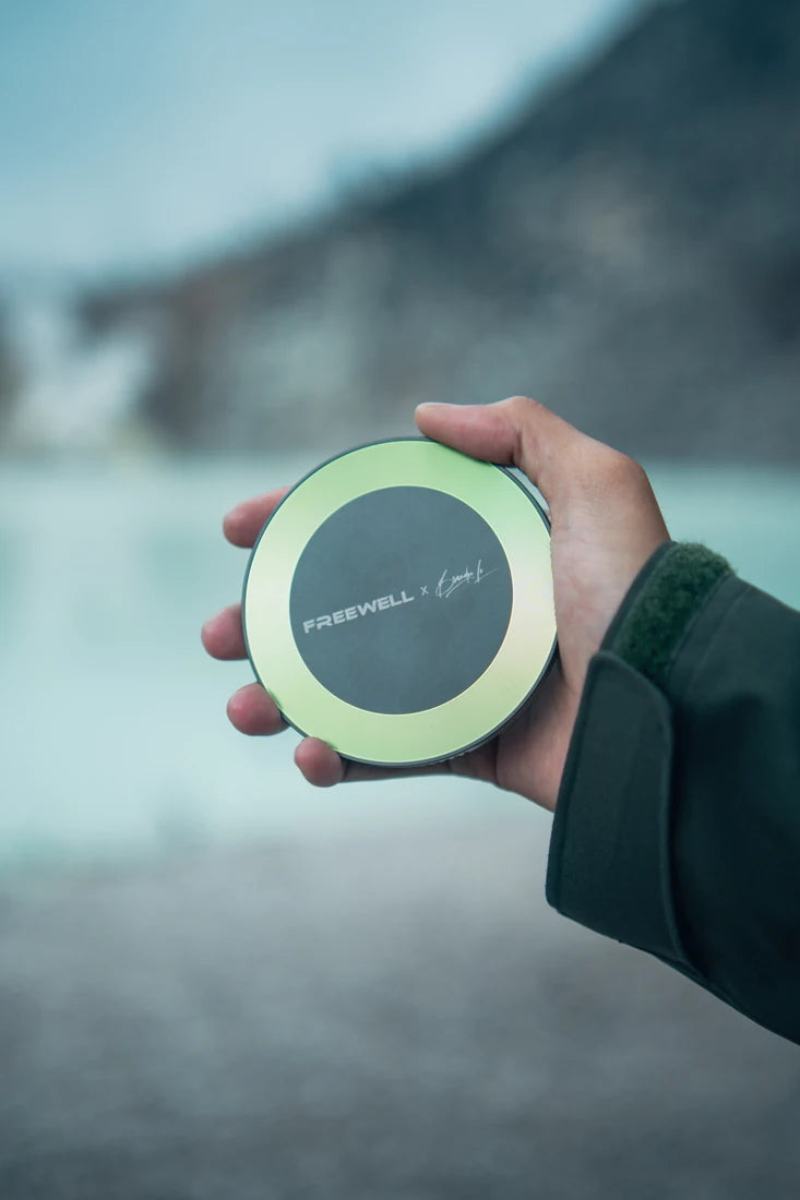 Filmmaker holding the Brandon Li x Freewell filter in the field