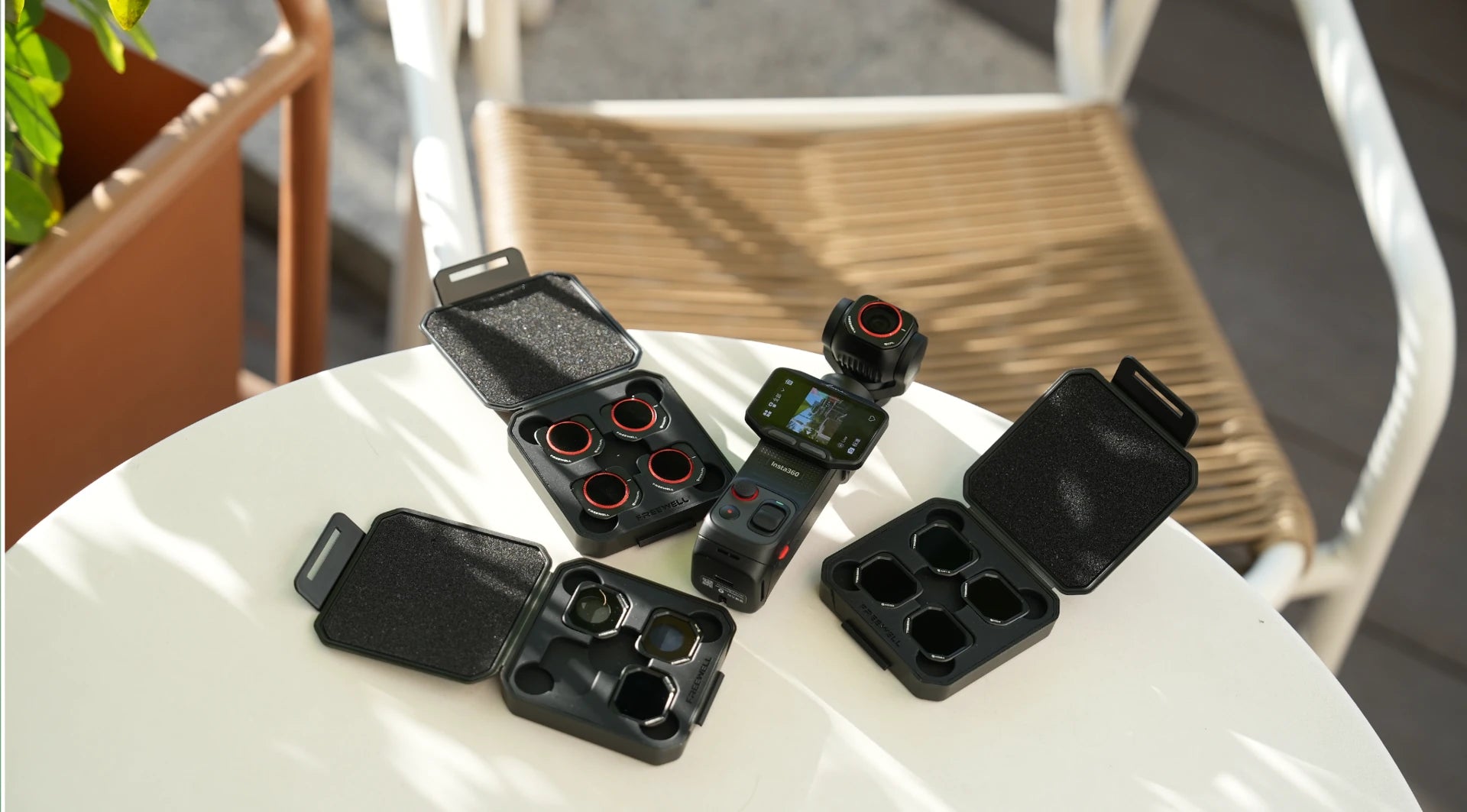 Freewell Insta360 Luna Pro Mega Kit with three open filter cases and a camera