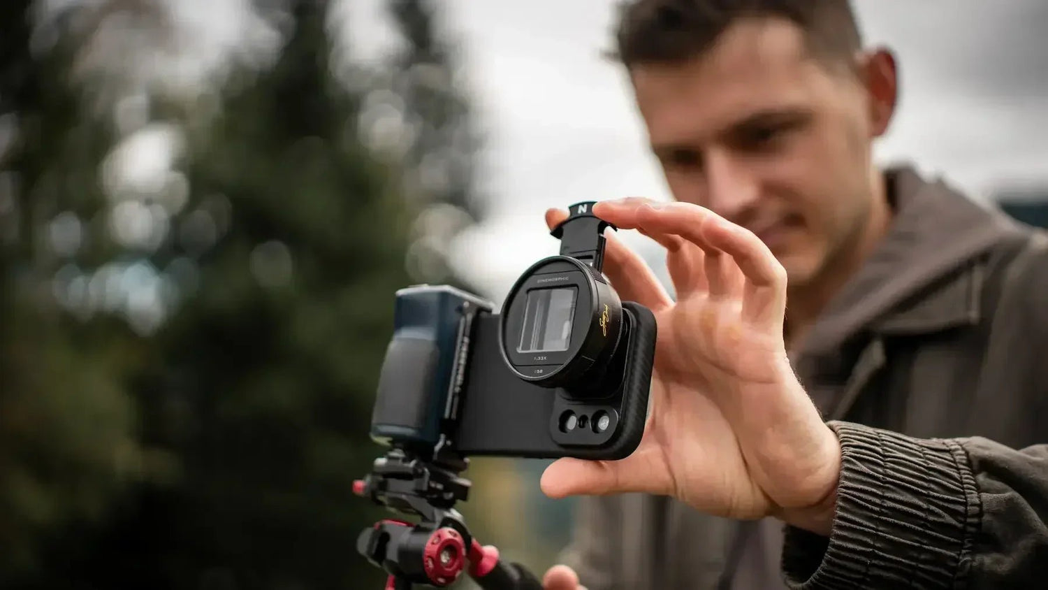 Freewell anamorphic lens mounted on a smartphone filmmaking rig outdoors