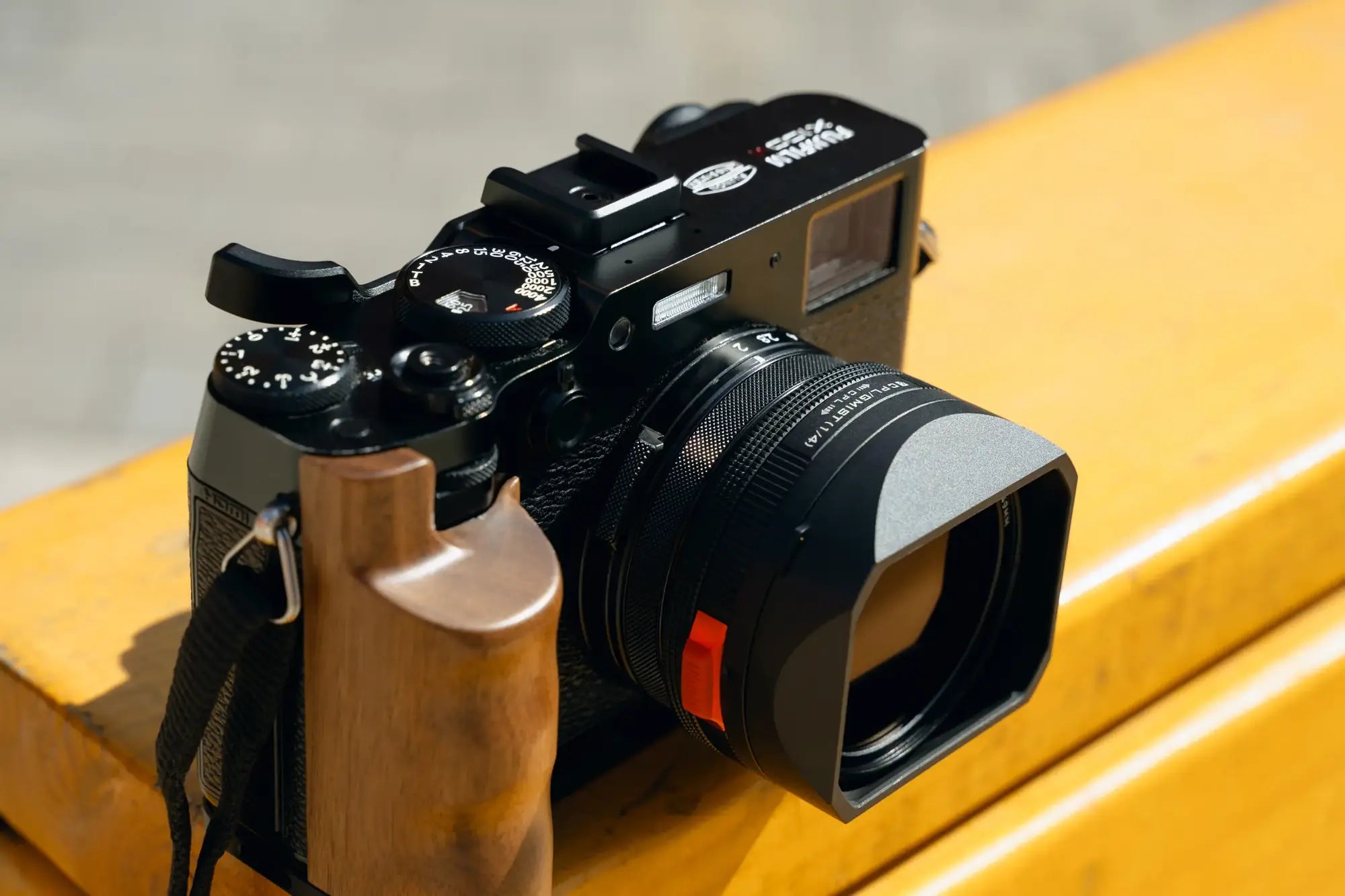 Top view of the Fujifilm X100VI showing the contoured wooden Freewell grip
