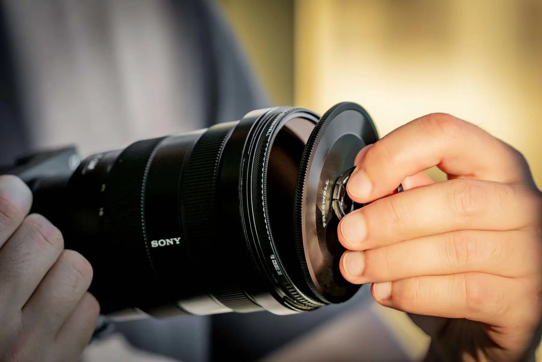 M2 filter being removed from a camera lens