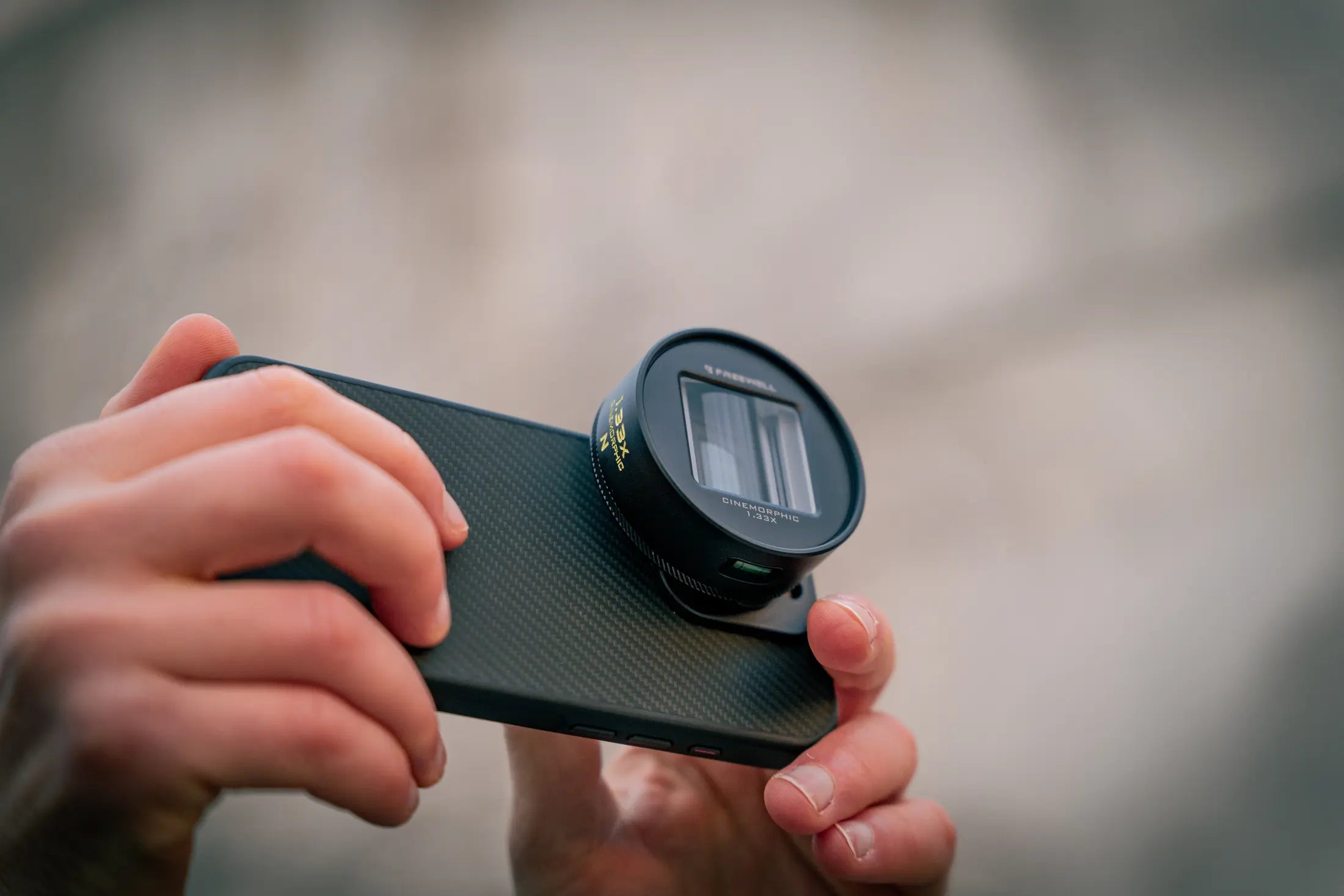 Freewell anamorphic lens mounted on a 17mm smartphone case