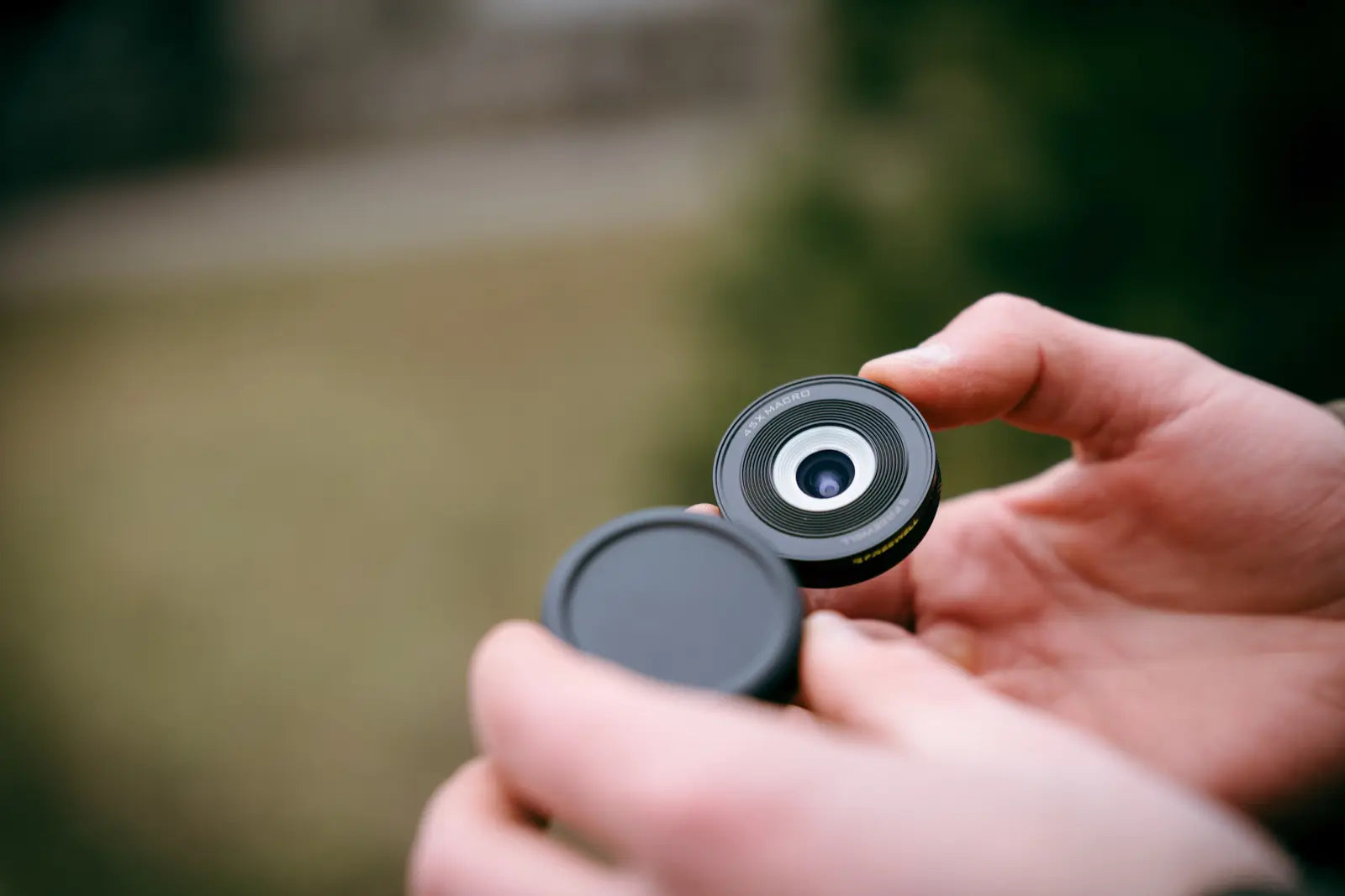 Freewell 45X Macro Lens held next to its protective cap