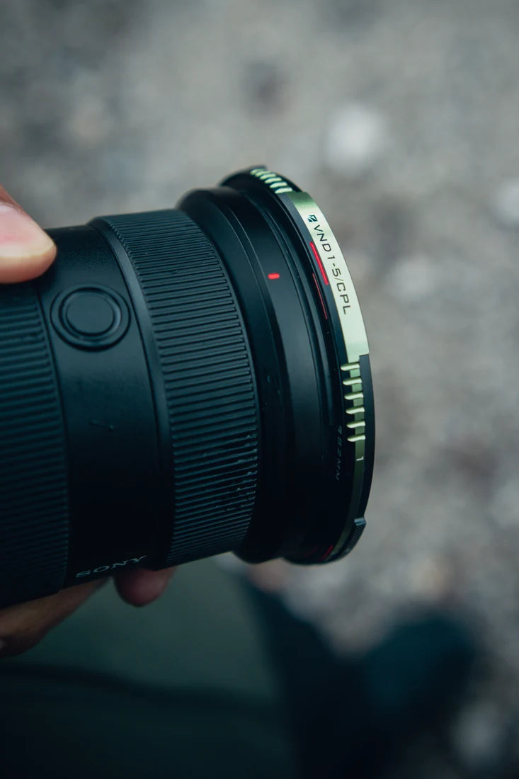 Close view of the slim green Brandon Li VND/CPL filter mounted on a camera lens