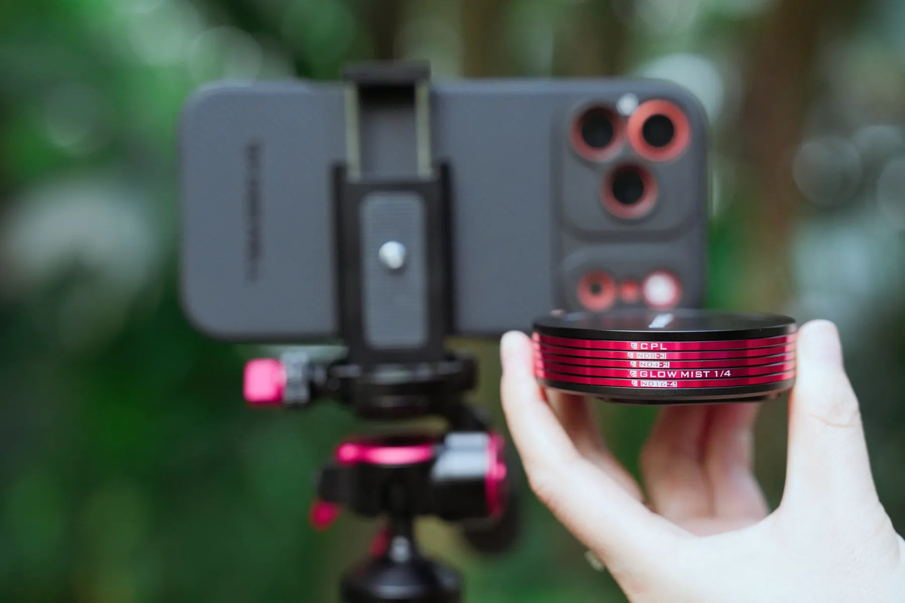 A hand presenting the compact stack of Freewell Quick Snap filters