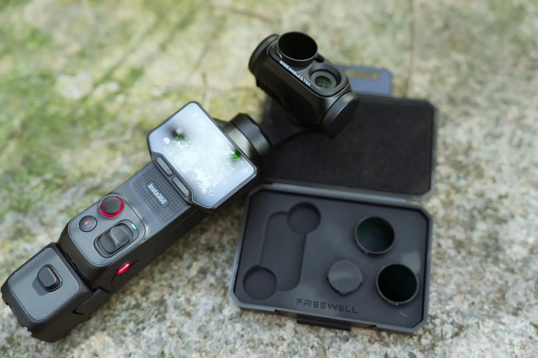 Insta360 Luna Ultra wide-angle lens kit arranged beside its protective case