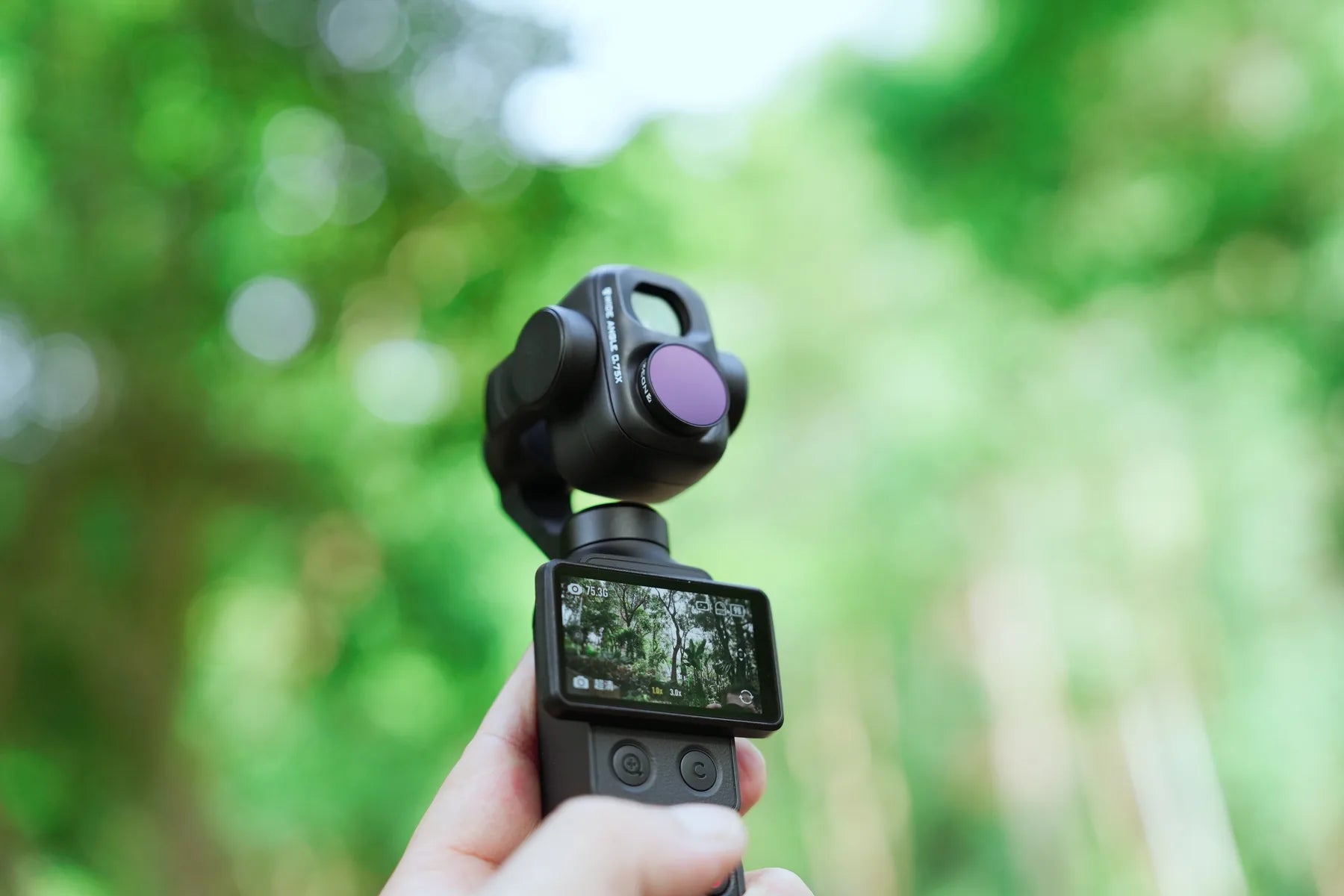 ND filter mounted over the Freewell wide-angle lens on DJI Osmo Pocket 4P