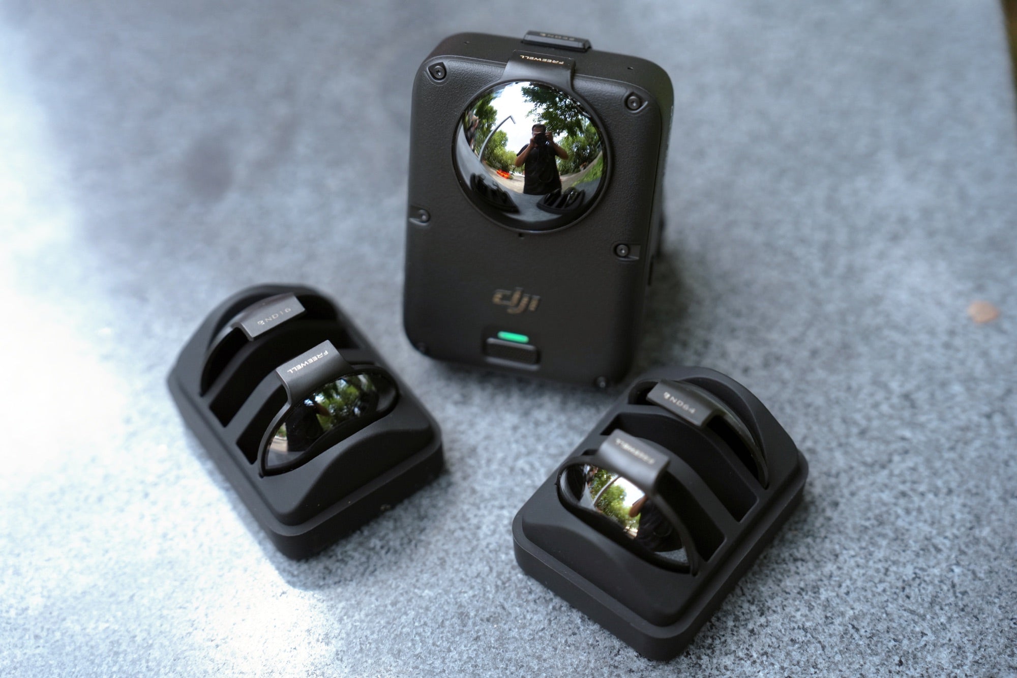 Creator changing a Freewell filter on DJI Osmo 360 II