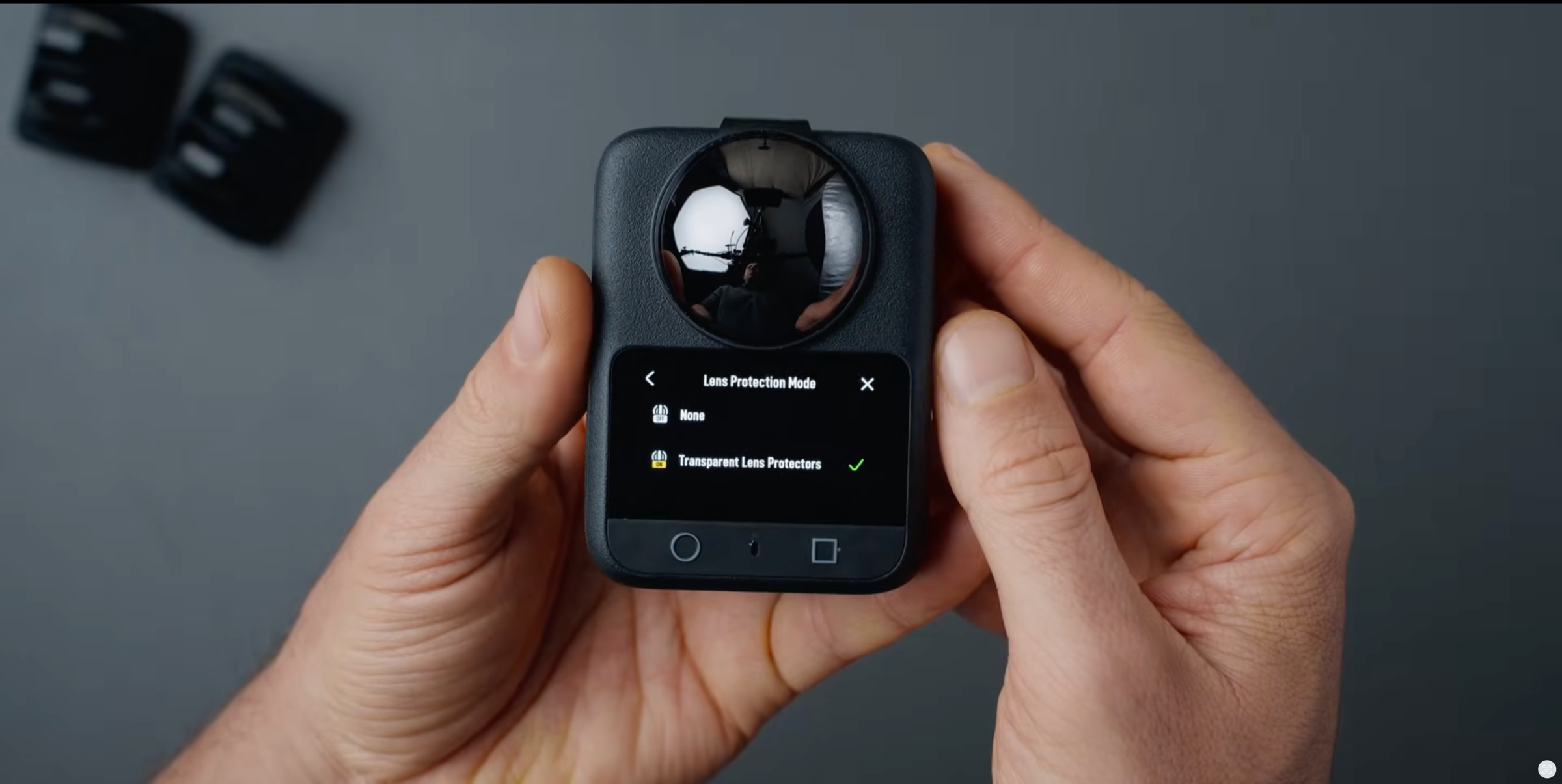 Tutorial frame showing DJI Osmo 360 with a Freewell filter and Transparent Lens Protectors selected in Lens Protection Mode