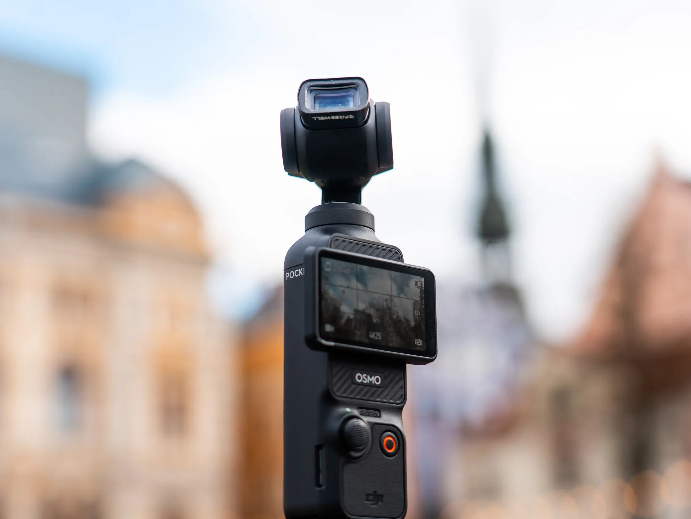DJI Osmo Pocket fitted with a Freewell creative lens in a city setting