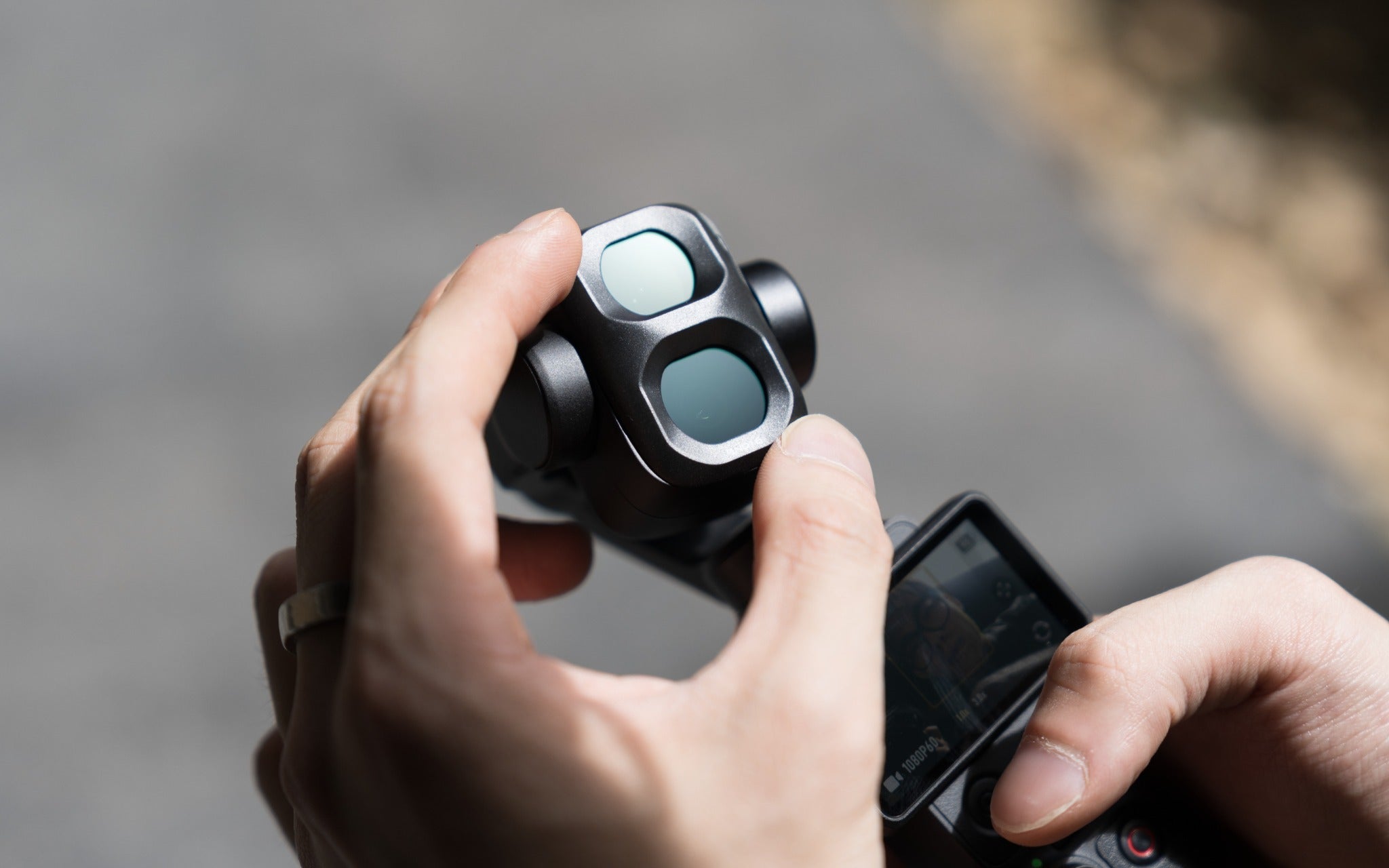 Freewell QuickSwap filter being installed on DJI Osmo Pocket 4P