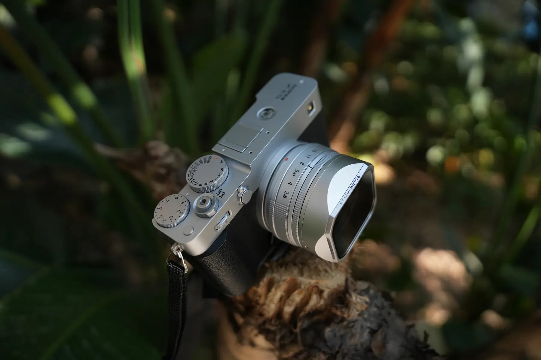 Silver Fujifilm X-E5 with lens hood and magnetic filter on the XF23mmF2.8 lens