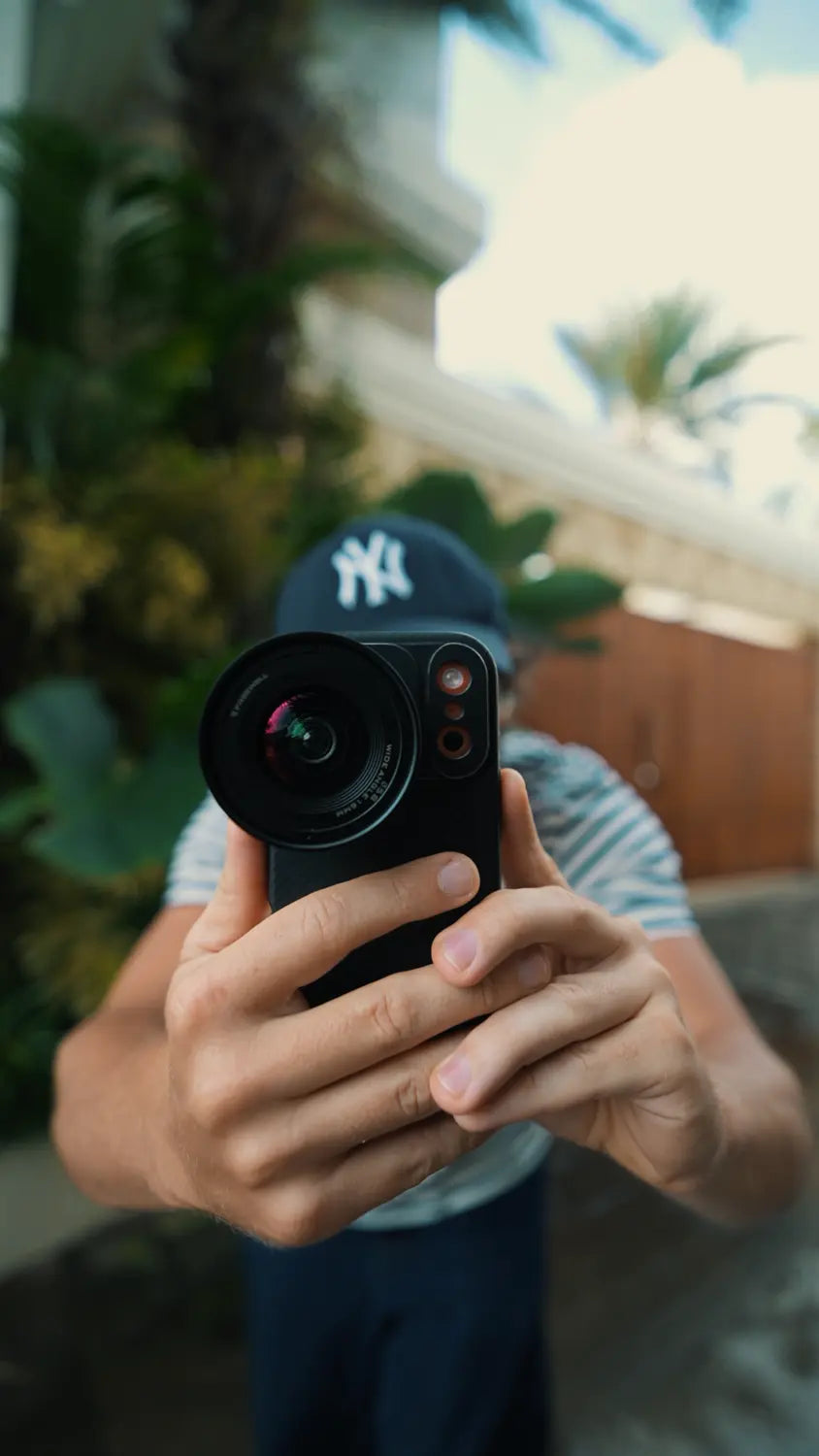 Creator filming handheld with the Freewell 16mm lens