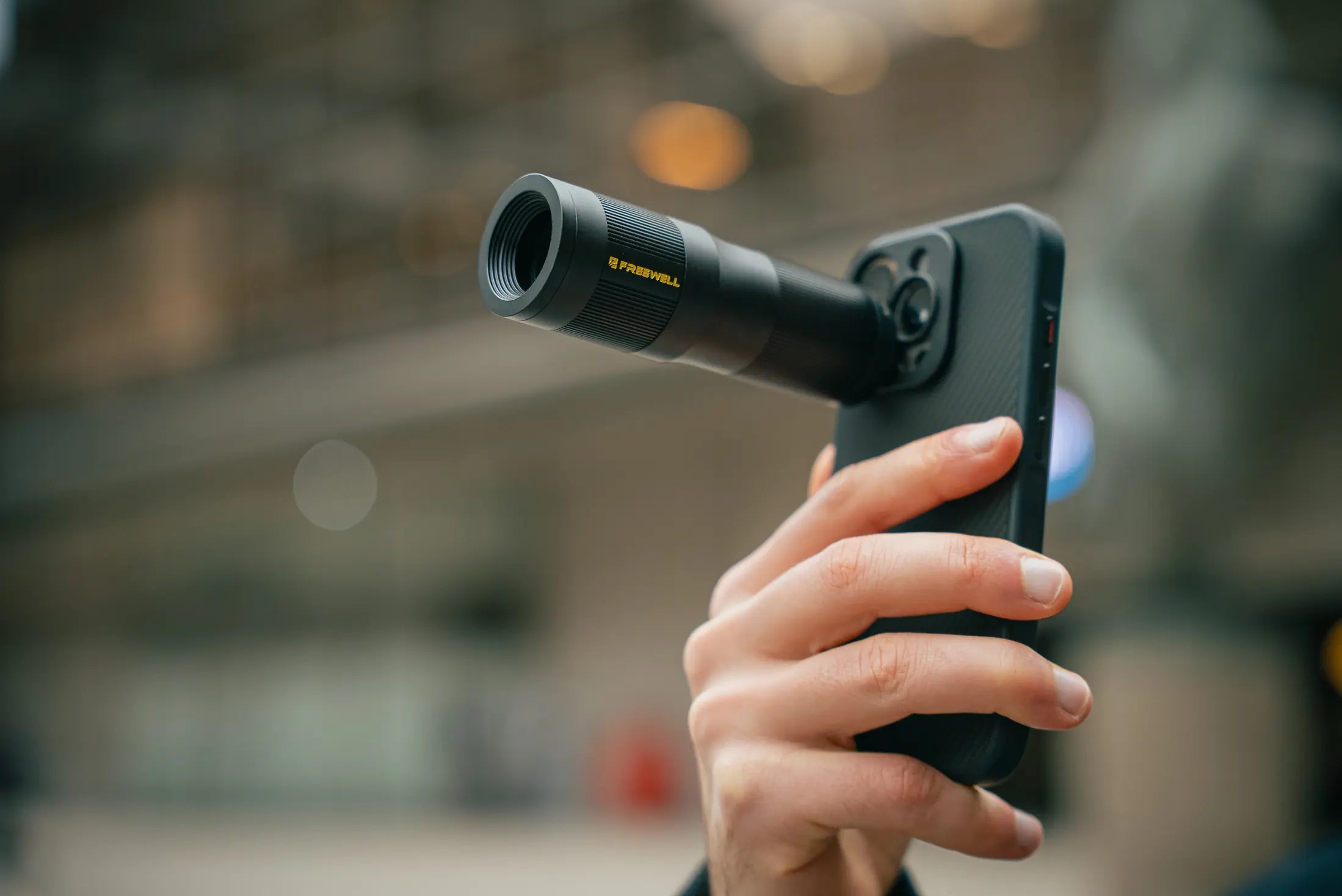 Freewell 6X Telephoto Lens mounted to a smartphone for long-range shooting