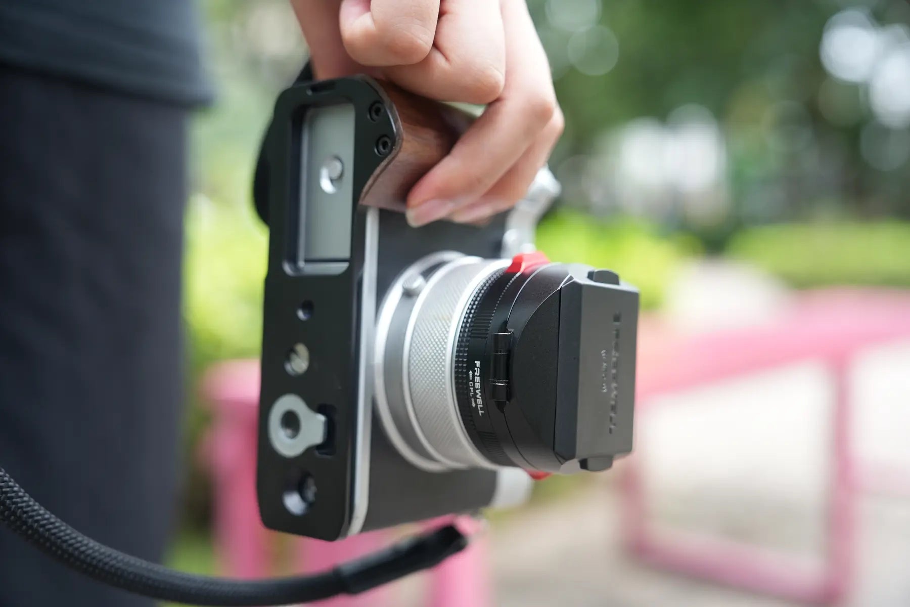 Bottom view of the Freewell GFX100RF L-bracket showing the integrated tripod mounting base