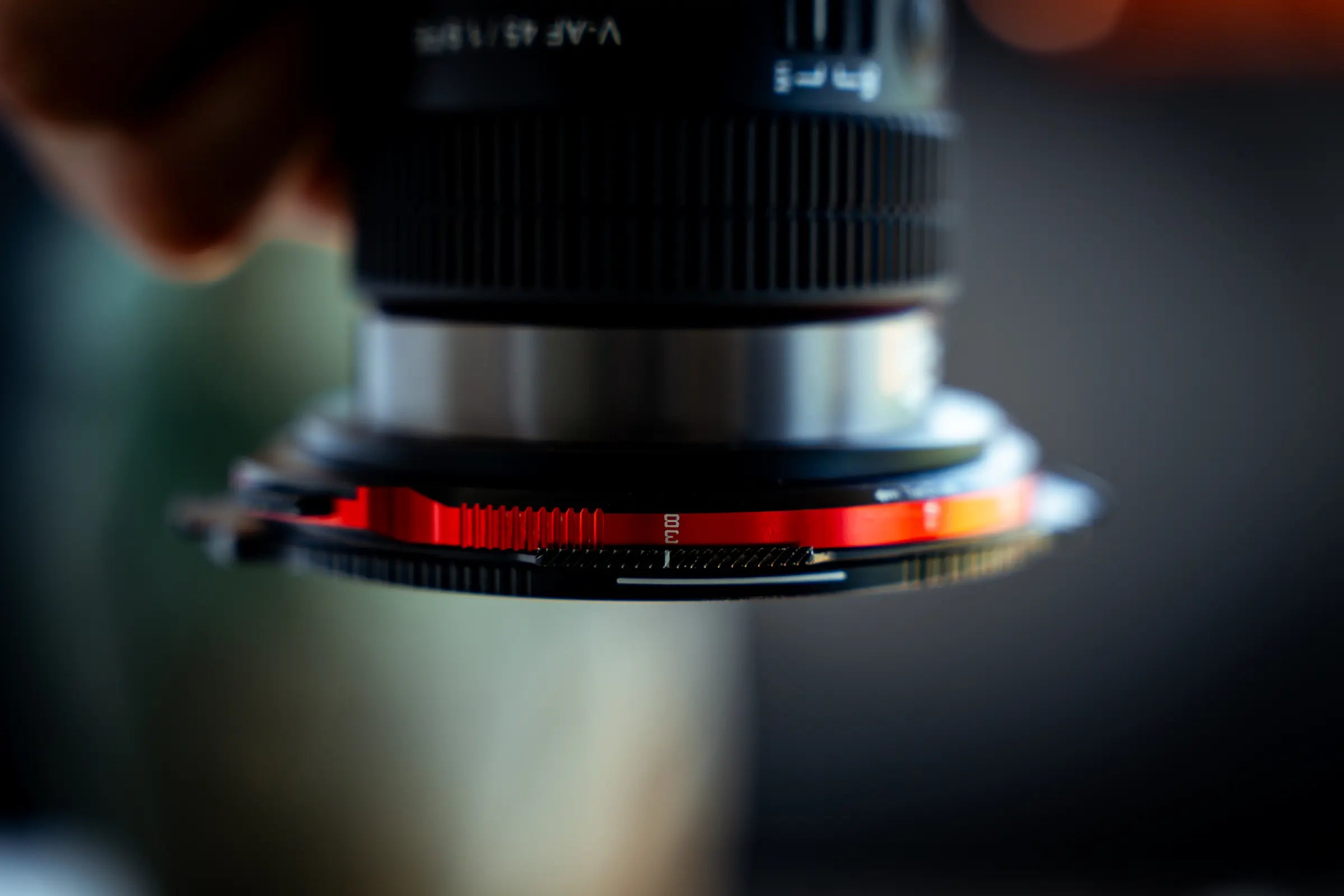Close side view of the Real Locking base ring mounted on a camera lens