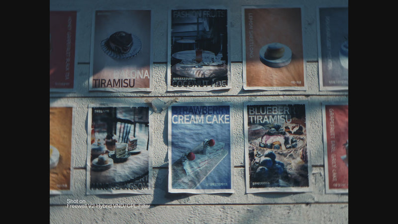A series of vibrant dessert posters on a wall, with a focus on the blurred and enhanced look created by the Freewell V2 Hybrid VND/CPL Filter, showing a variety of sweet treats like tiramisu, coconutade, and cream cake.