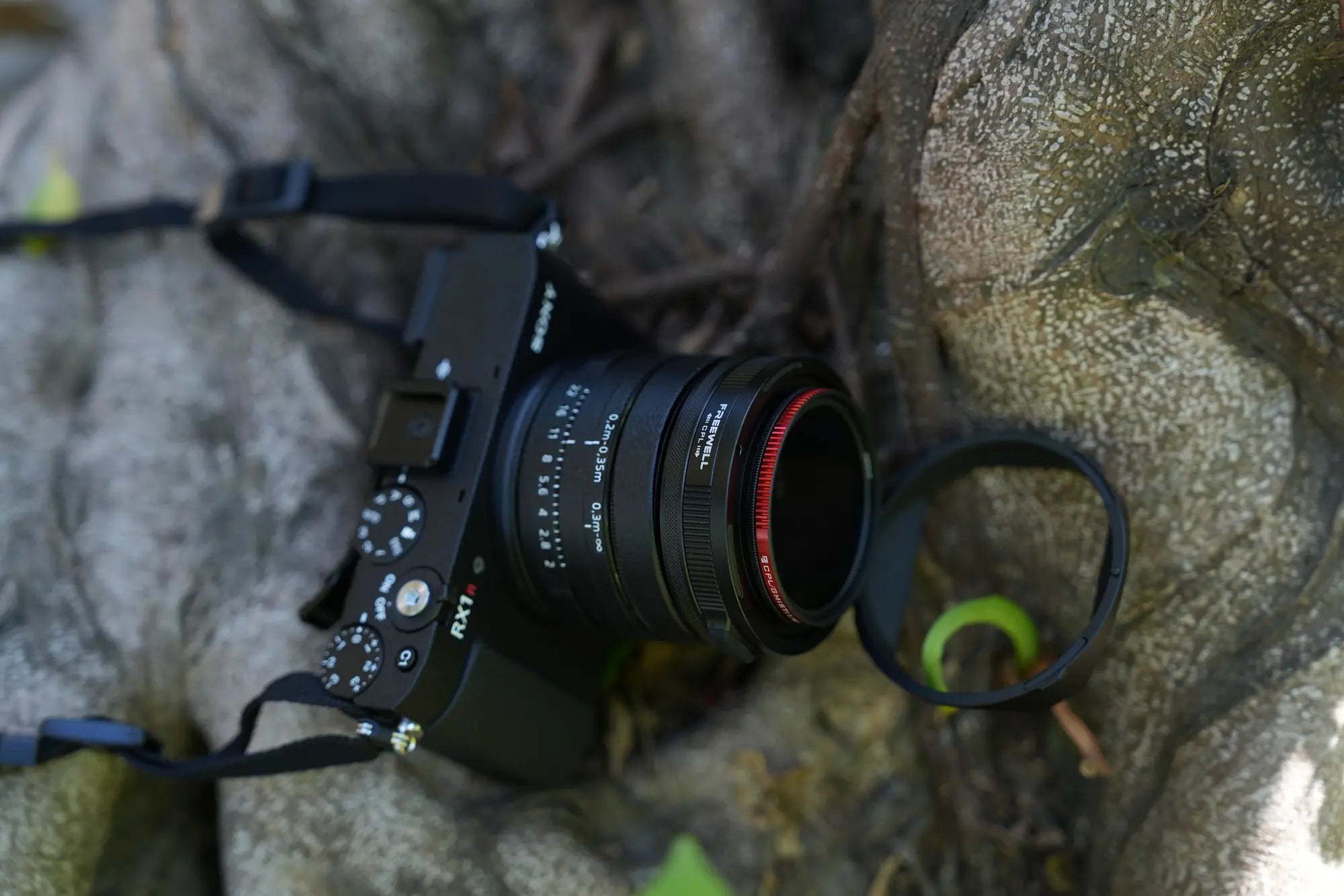 Sony RX1R III lens hood flipped forward for filter access